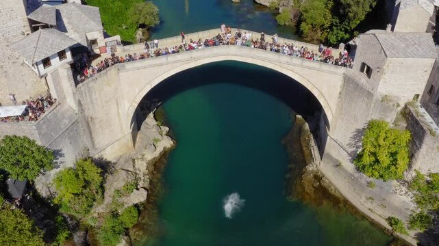 Drone view of Mostar bridge in Bosnia and Herzegovina - jumping from the bridge