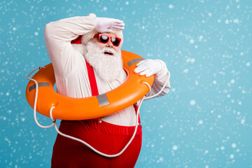 Portrait of his he attractive cheerful cheery dreamy white-haired Santa swimmer sailor wearing safe...