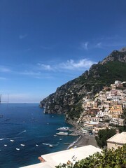 Picturesque Coastal Village of Positano with Boats and Deep Blue Water