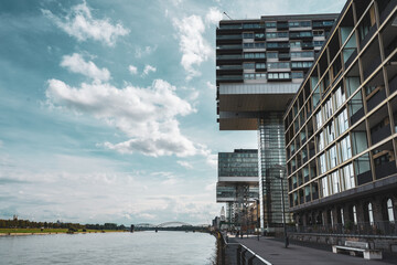 modern architectural style of the Kranhäuser buildings along the Rhine River in Cologne, Germany....