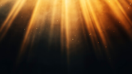 Abstract image featuring beams of warm golden light filtering through a dark background with floating particles, creating an ethereal and dreamy atmosphere.
