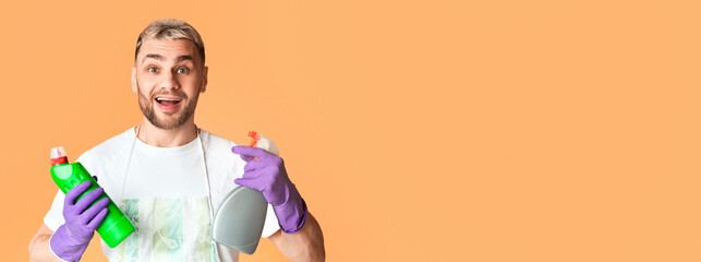 Guy with cleaning supplies in his hands, free space