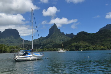 A sail boat in the tropical lagoon of Moorea Island in French Polynesia