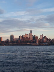 "Sunset Cityscape Over Water"