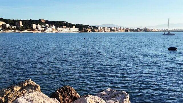 Port of Anzio in Italy. Colours reflections in the water and vivid colors illuminate the scene with the boats moving. Located on the Tyrrhenian Sea dedicated to tourism. Natural beauty in Europe