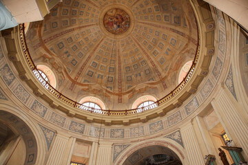 Intricate Round Ceiling of the Church: Stunning Painted Frescoes and Elaborate Carvings Showcasing Sacred Artistry