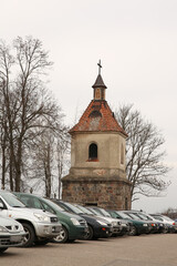 Bell Tower of a Church Rising Above a Parking Lot on a Beautiful Autumn Day