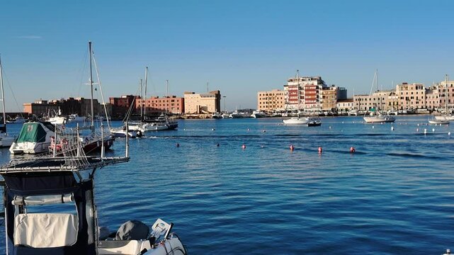 Port of Anzio in Italy. Colours reflections in the water and vivid colors illuminate the scene with the boats moving. Located on the Tyrrhenian Sea dedicated to tourism. Natural beauty in Europe