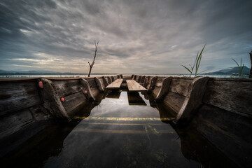 Old shipwreck with water on a cloudy day