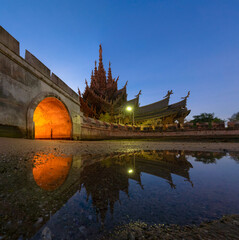 Old wooden castle reflecting in the water