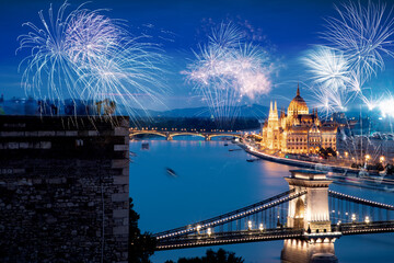 Fototapeta premium fireworks display over parliament in Budapest New Year in the city