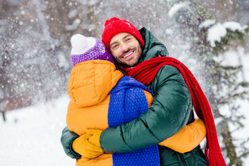 Photo of cute shiny girlfriend boyfriend dressed vests smiling hugging smiling enjoying walking...