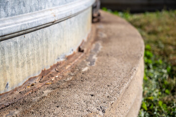 Naklejka premium waterproof Joint seam of a flat bottom metal grain storage bin. 