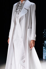 Long dress and jacket on a female figure, minimal design