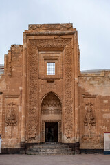 The inside of a building with arched windows and pillars. Ishakpasa palace in Agri Doguneyazit city, Turkey