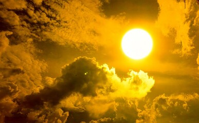 Bright Sun Shining through Golden Clouds