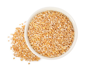 Dry wheat groats in bowl isolated on white, top view