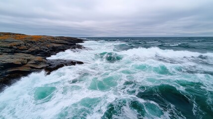 Obraz premium Tidal River Surging In and Out of Rocky Coastline