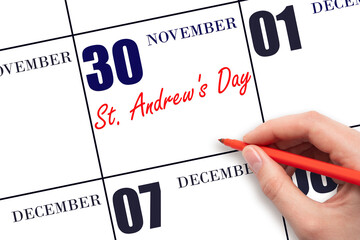 November 30. Hand writing text St. Andrew's Day on calendar date. Save the date.