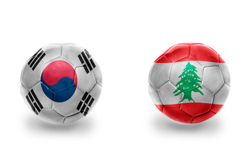 football balls with national flags of lebanon and south korea ,soccer teams. on the white...