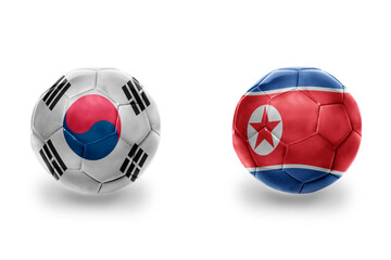 Fototapeta premium football balls with national flags of north korea and south korea ,soccer teams. on the white background.