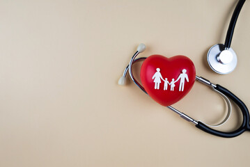 Health insurance concept with family and stethoscope on beige background with copy space