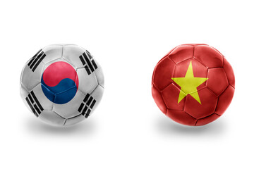 Obraz premium football balls with national flags of vietnam and south korea ,soccer teams. on the white background.