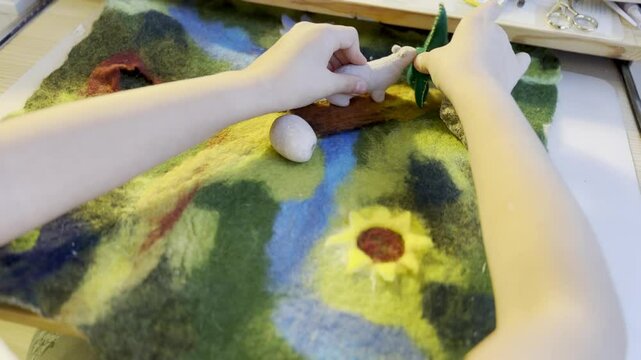 Close-up of Hands payinga Felted Wool Bunny Figurine, Crafting Handmade Animal Toys, Creative Art Process in Warm, Waldorf toys