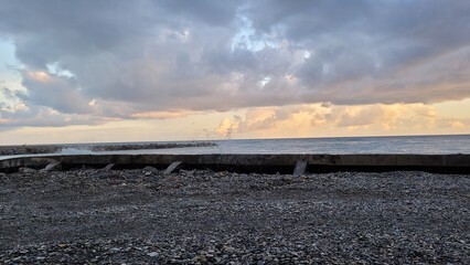 Fototapeta premium Sea, beach and pebbles, clouds in the sea. 