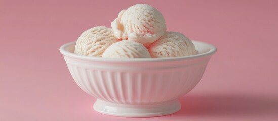 A bowl of scooped ice cream against a pink background.