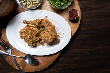 Fototapeta premium Roast Chicken Curry on a Wooden Cutting Board