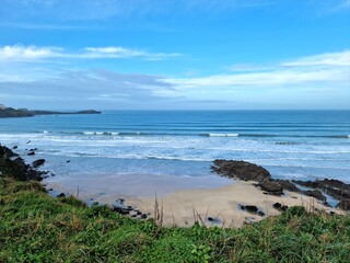 Blue sky and sandy beach from sand dunes