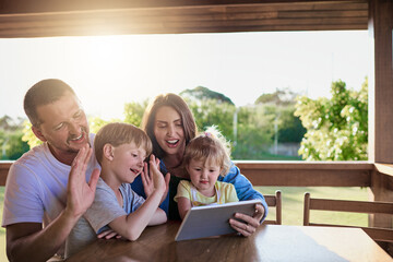 Parents, children and tablet for video call, outdoor and happy on patio, wave or application at family home. People, kids and smile in backyard with mother, father or touchscreen for contact in Spain
