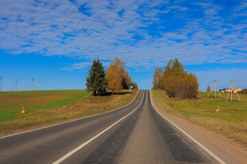 Fototapeta premium Autumn landscape, road and highway, asphalt and roadside.