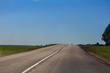 Fototapeta premium Autumn landscape, road and highway, asphalt and roadside.