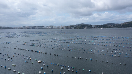 Beautiful aerial view of Guanabara Bay with a shellfish farm and fishing community in Jurujuba, Niterói, Rio de Janeiro, Brazil