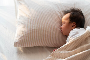 Peaceful Baby Sleeping on Pillow in Soft Morning Light