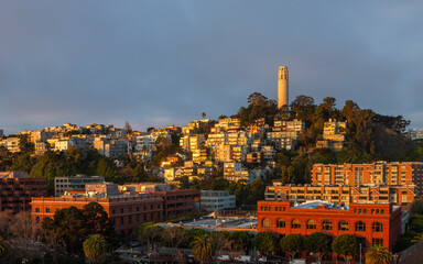 Exposure done at sunrise of Coit Tower, from Pier 27, a slender white concrete tower rising from the top of Telegraph Hill and a emblem of San Francisco's skyline, California