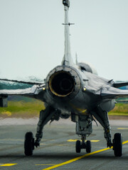 Fototapeta premium Swirling hot air behind the turbine exhaust of a working fighter jet, blurred photo