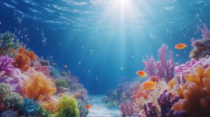 Obraz premium Vibrant underwater coral reef teeming with colorful fish and sunlight filters through water in a tranquil ocean setting