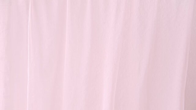 Soft pink curtain fabric, organza, translucent tulle gently flutters, sways delicately, minimalistic background, homely romantic atmosphere comfort, tranquil ambiance, relaxation and calm
