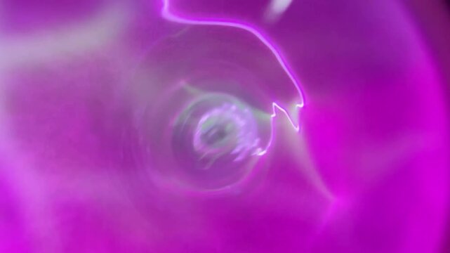 Pink gas electric discharge in transparent glass tube