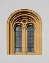 Fototapeta premium Isolated neo-romanesque round arched window with column in the village church facade of Lingenfeld, Germany