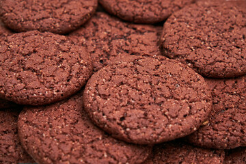 A white plate filled with chocolate cookies