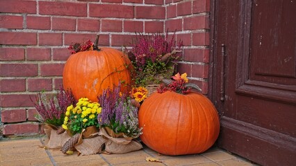 Autumn Decoration Made of Pumpkins and Heather on House Porch