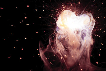 A bright flash of light and a sheaf of sparks in a cloud of smoke. Miniature Universe. Design...