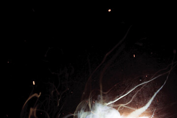 A bright flash of light and a sheaf of sparks in a cloud of smoke. Miniature Universe. Design...