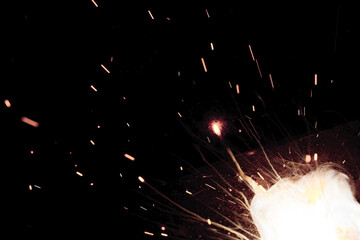A bright flash of light and a sheaf of sparks in a cloud of smoke. Miniature Universe. Design...