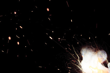 A bright flash of light and a sheaf of sparks in a cloud of smoke. Miniature Universe. Design...