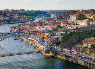 Obraz premium Aerial drone view of Dom Luis I Bridge over Douro river and panoramic Porto view. Portugal city landscape